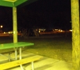 Sunrise Park Playground At Night With Children From NA Meeting Playing In The Dark